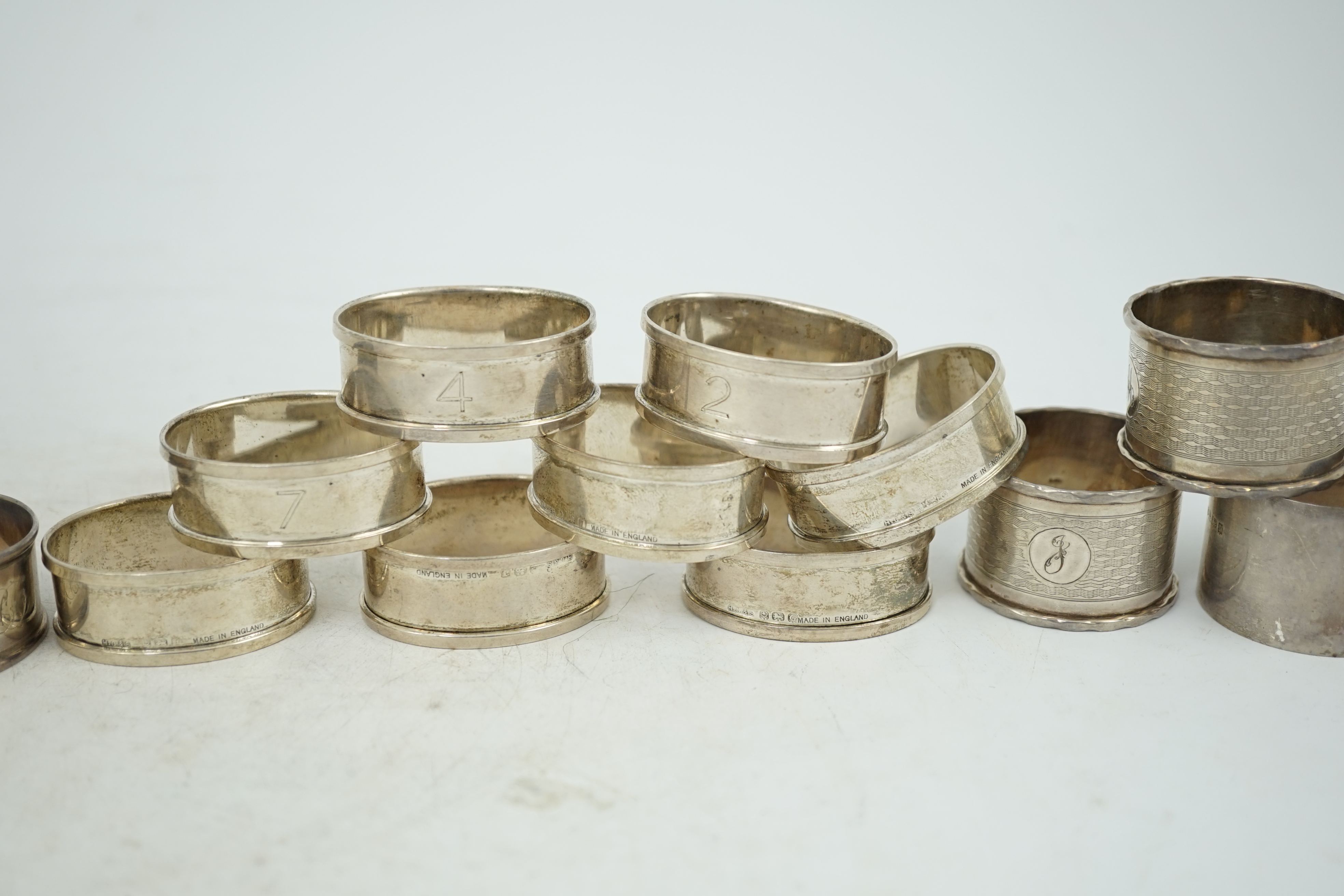 A matched set of eight early 1930's silver napkin rings and four other silver napkin rings including a pair, Birmingham, 1929, 5.3oz.